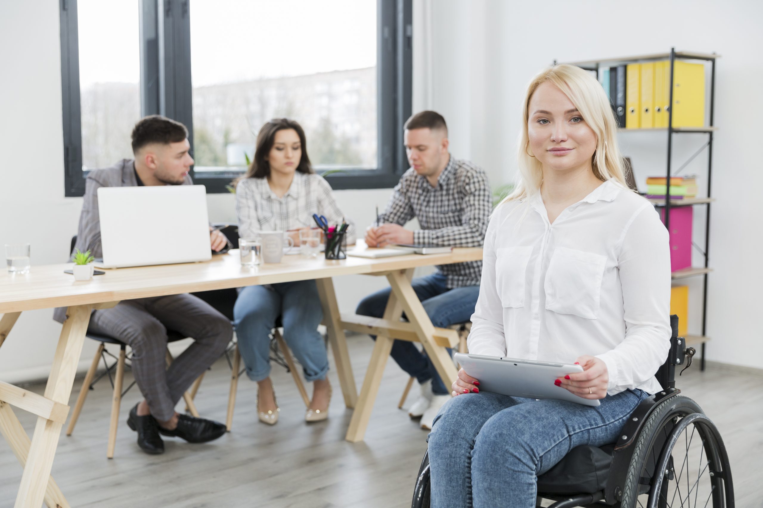 front-view-woman-wheelchair-posing-office